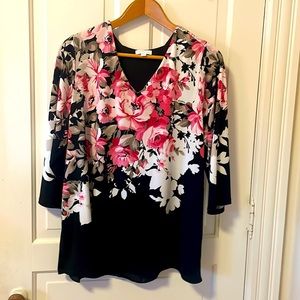 Black and floral top with back tulip style detail.